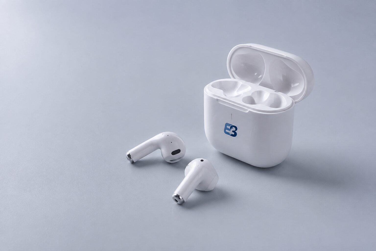 White entry-level custom Bluetooth TWS earbuds with an open EarbudSource branded charging case